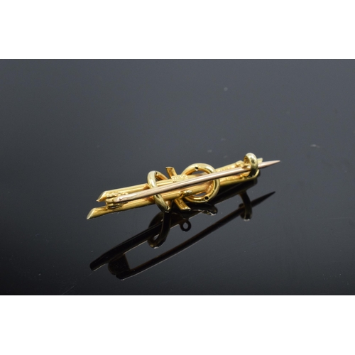 216 - 15ct gold knot bar brooch, 2.1 grams, 4cm wide.