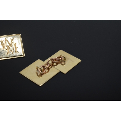 219 - 9ct gold cufflinks with engineered decoration and initials, 3.4 grams.