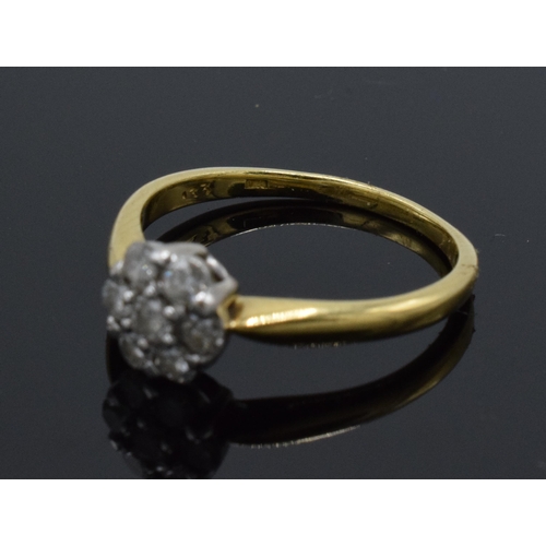 226 - 18ct gold diamond daisy ring, 2.6 grams, size N.