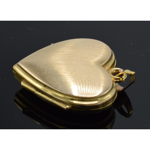 228 - 9ct gold (front and back) heart shaped locket, 2.3 grams.