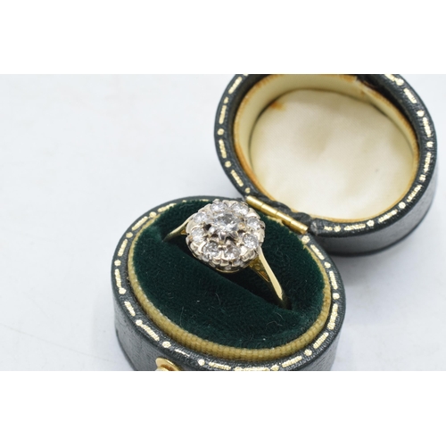 234 - 18ct gold and platinum daisy ring set with diamonds, approximately 0.5 carat of diamonds, UK size T,... 