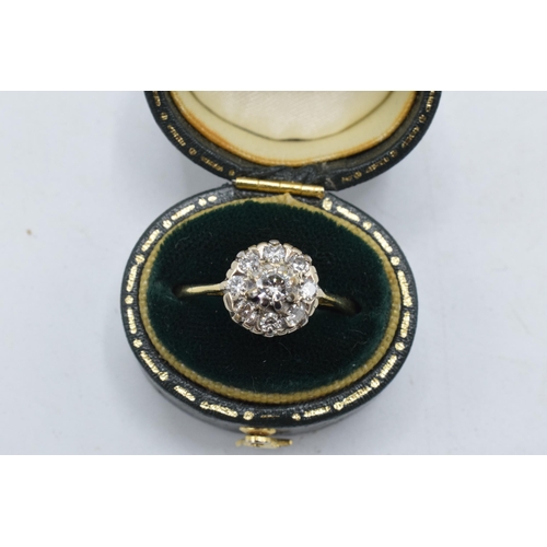 234 - 18ct gold and platinum daisy ring set with diamonds, approximately 0.5 carat of diamonds, UK size T,... 