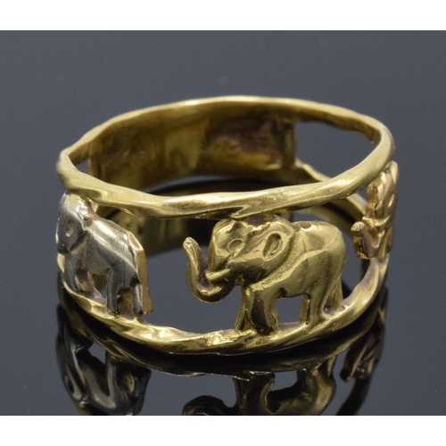 240 - 18ct gold and white gold ring with walking elephants, 3.3 grams, size P/Q. No hallmarks but it tests... 