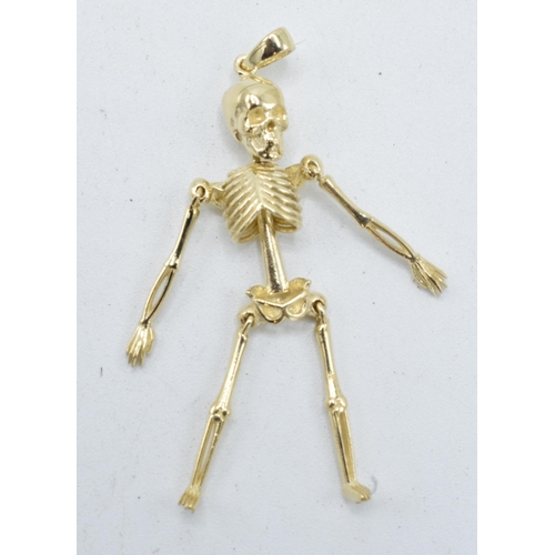 248 - 9ct gold pendant in the form of an anatomical skeleton. 2.4 grams. 4.5cm tall.