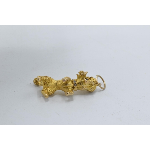 250 - 9ct gold heavy charm in the form of a poodle with stone-set eyes and collar, 11.1 grams, fully hallm... 