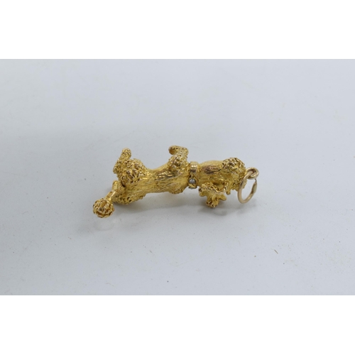 250 - 9ct gold heavy charm in the form of a poodle with stone-set eyes and collar, 11.1 grams, fully hallm... 