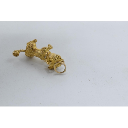 250 - 9ct gold heavy charm in the form of a poodle with stone-set eyes and collar, 11.1 grams, fully hallm... 