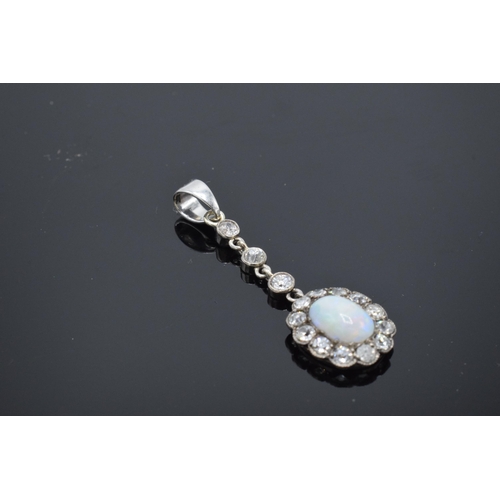 254 - Platinum and diamond pendant set with colourful white opal and diamonds, 9ct bail attached, 3.5cm lo... 