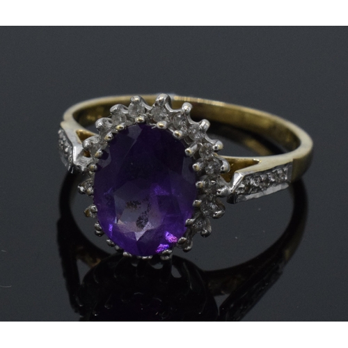 262 - 9ct gold amethyst and diamond surround dress ring, 2.6 grams, size M.