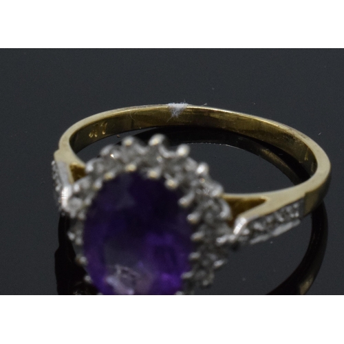 262 - 9ct gold amethyst and diamond surround dress ring, 2.6 grams, size M.