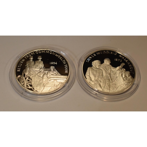 31 - A pair of sterling silver proof-like coins to include Silver Wedding Walkabout 1972 and Return From ... 