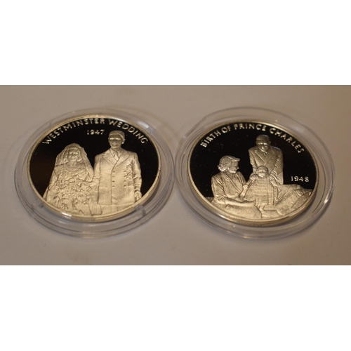 33 - A pair of sterling silver proof-like coins to include Birth of Prince Charles and Westminster Weddin... 