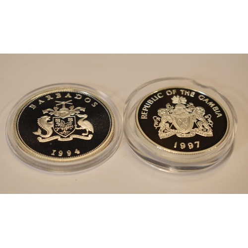 36 - A pair of sterling silver proof-like coins to include Barbados One Dollar and Gambia 2 Dalasis, in g... 