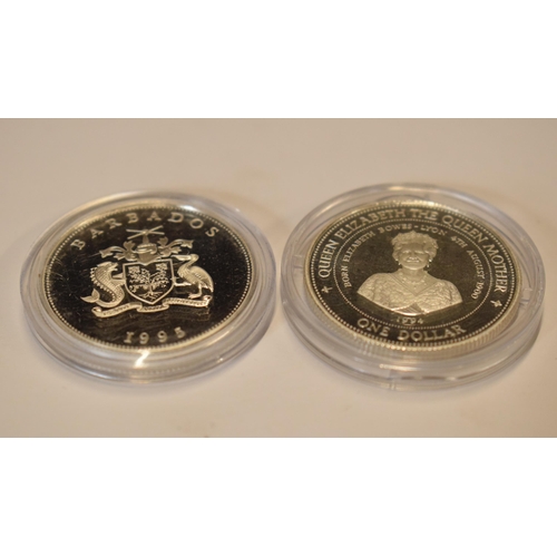 37 - A pair of sterling silver proof-like coins to include Barbados One Dollar and another similar, in go... 