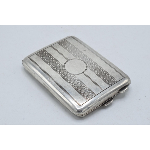 48 - Hallmarked silver slimline cigarette / card case with engineered decoration, 33.8 grams, 6.5cm long.... 