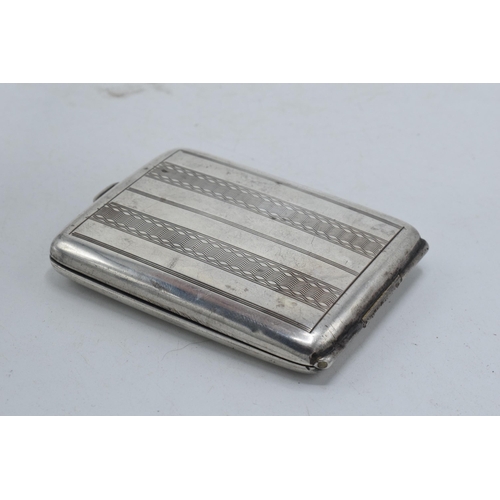 48 - Hallmarked silver slimline cigarette / card case with engineered decoration, 33.8 grams, 6.5cm long.... 