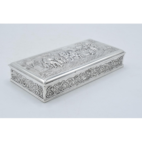 60 - Dutch silver plated cigarette box with repoussé decoration of a tavern scene. 18 x 8cm.