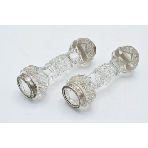 66 - Silver and glass knife rests, a pair (2).