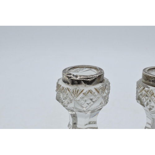 66 - Silver and glass knife rests, a pair (2).