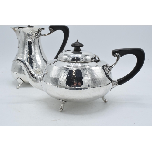 76 - Hallmarked silver four piece tea set with ebonised handles and finials to consist of a teapot, coffe... 