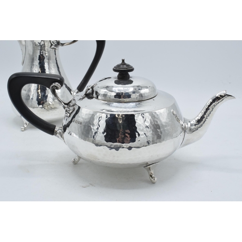 76 - Hallmarked silver four piece tea set with ebonised handles and finials to consist of a teapot, coffe... 