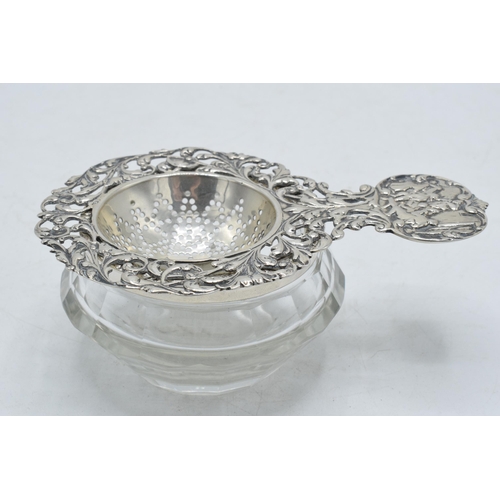 93 - Antique hallmarked silver tea strainer and silver topped collecting glass.