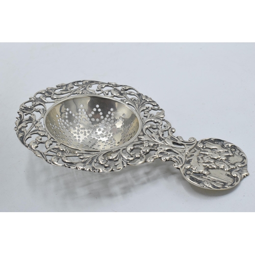 93 - Antique hallmarked silver tea strainer and silver topped collecting glass.