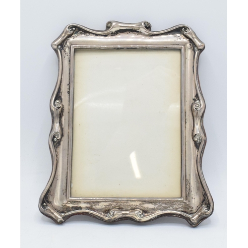 95 - Hallmarked silver scroll-like photoframe, Chester 1899, Colin Hewer Cheshire (missing easel back), 1... 