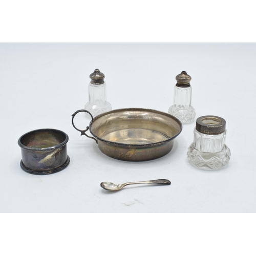 97 - A collection of silver to include hallmarked small handled dish, silver napkin ring and silver toppe... 