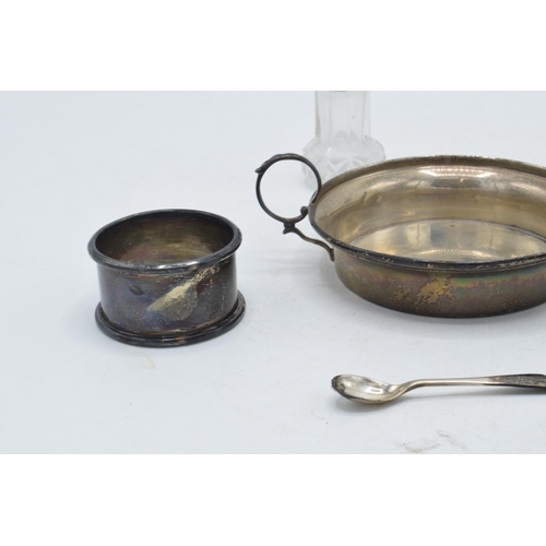 97 - A collection of silver to include hallmarked small handled dish, silver napkin ring and silver toppe... 