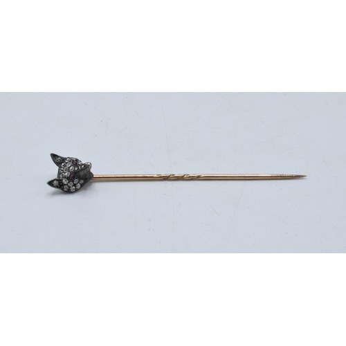 232 - Diamond and ruby set fox head stick pin with 9ct gold pin, 6.5cm long.