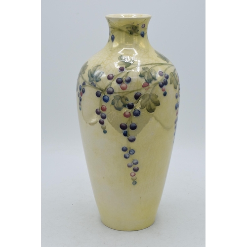 85 - Moorcroft lustre vase with grape and vine pattern, professionally restored, 27cm tall.