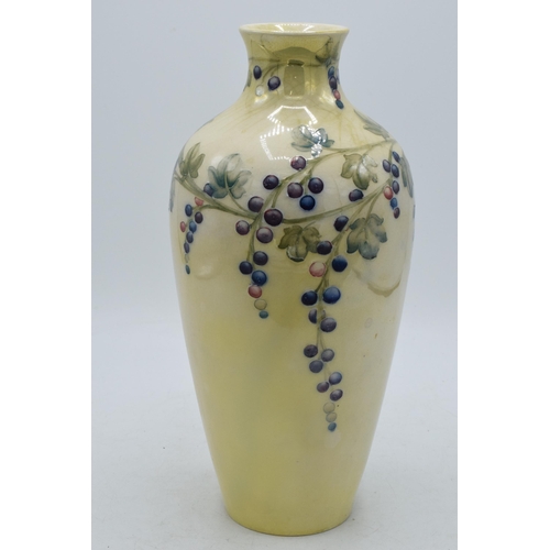 85 - Moorcroft lustre vase with grape and vine pattern, professionally restored, 27cm tall.