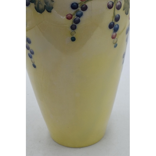 85 - Moorcroft lustre vase with grape and vine pattern, professionally restored, 27cm tall.