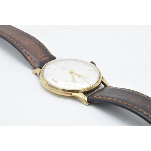 111A - Roidor 9ct gold cased gentleman's wristwatch on leather strap, 36mm wide. Winds, runs and ticks.