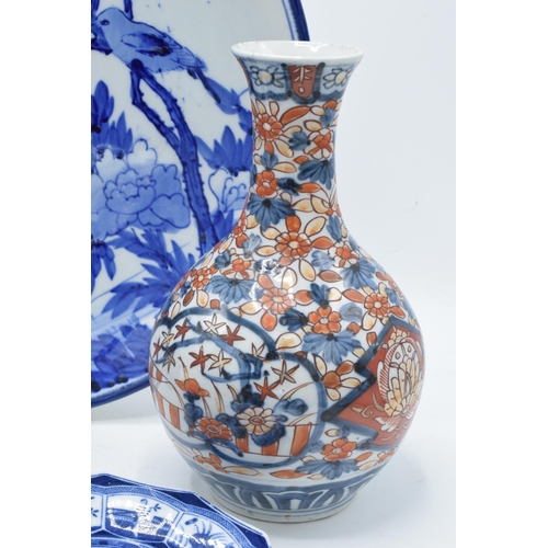 26 - A collection of 19th century and later oriental pottery items to include a large Japanese blue and w... 