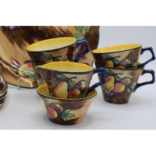 33A - Hollinshead and Kirkham of Tunstall (H&K) pottery tea ware decorated with a fruit scene to include 4... 