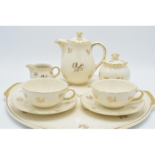 35 - Villeroy and Boch Mettlach pottery tea for 2 set to consist of 2 cups, 2 saucers, tea / coffee pot, ... 