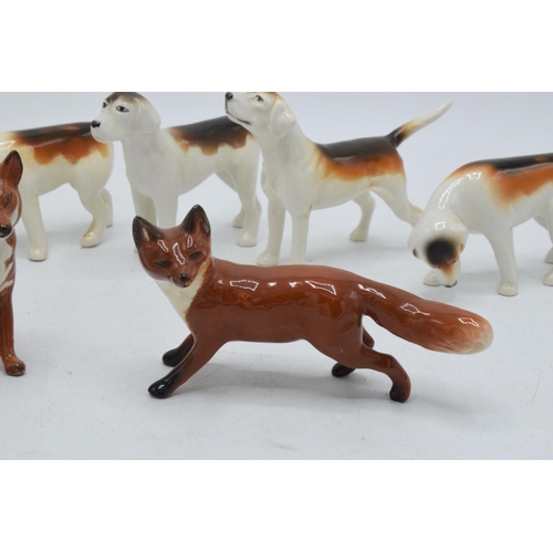 62 - A collection of Beswick to include 5 foxhounds and 2 foxes (7).