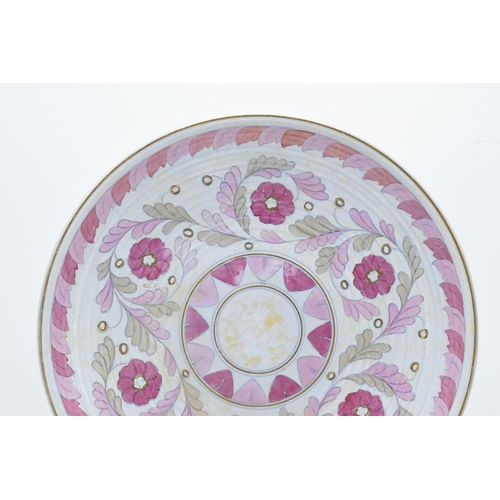 73 - Crown Ducal Charlotte Rhead charger with foliage in pink and purple colours with gilding, 32cm diame... 