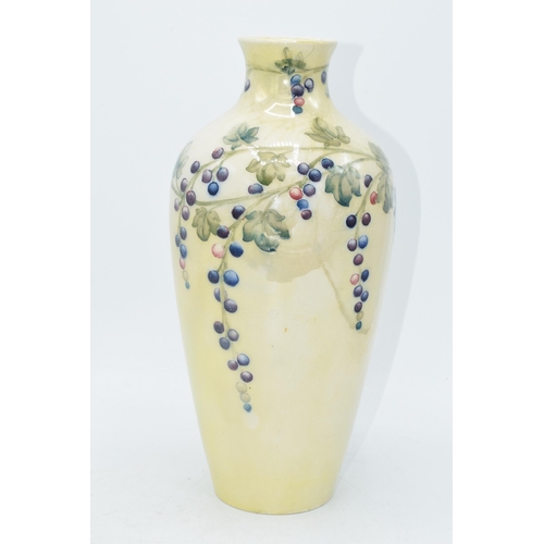 85 - Moorcroft lustre vase with grape and vine pattern, professionally restored, 27cm tall.