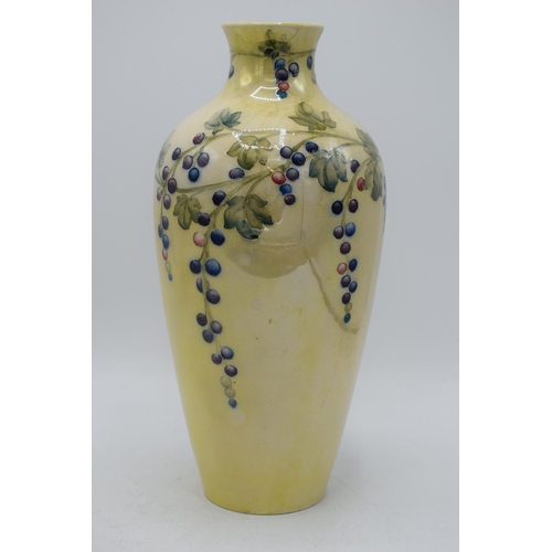 85 - Moorcroft lustre vase with grape and vine pattern, professionally restored, 27cm tall.