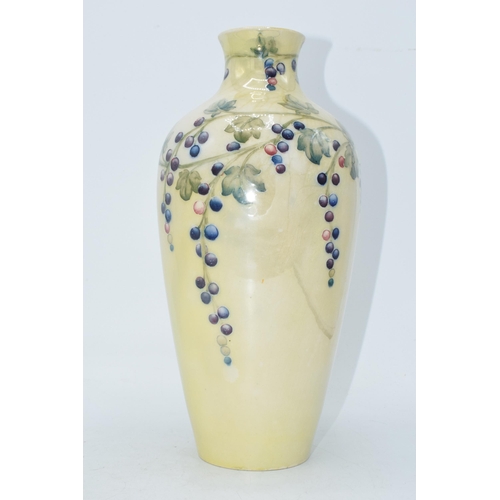 85 - Moorcroft lustre vase with grape and vine pattern, professionally restored, 27cm tall.