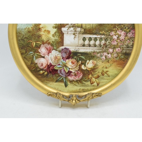 95A - Edwin Steele painted porcelain plaque in gilt-style frame of a garden wall and foliage design, 33cm ... 