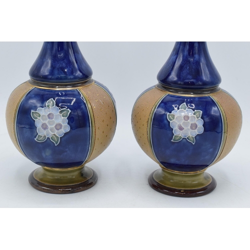 97 - Royal Doulton Lambeth stoneware vases with low shoulder and onion shape body decorated with floral d... 