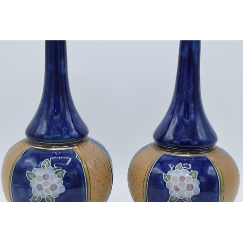 97 - Royal Doulton Lambeth stoneware vases with low shoulder and onion shape body decorated with floral d... 