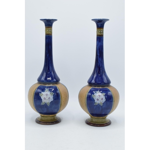 97 - Royal Doulton Lambeth stoneware vases with low shoulder and onion shape body decorated with floral d... 