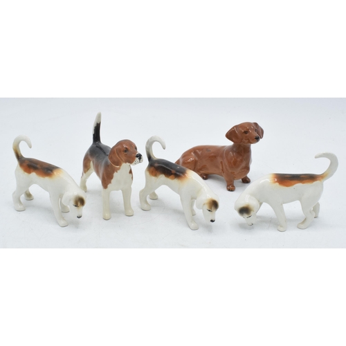 60F - Beswick to include 3 foxhounds, a beagle and a dachshund (5).