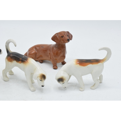 60F - Beswick to include 3 foxhounds, a beagle and a dachshund (5).