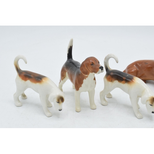 60F - Beswick to include 3 foxhounds, a beagle and a dachshund (5).